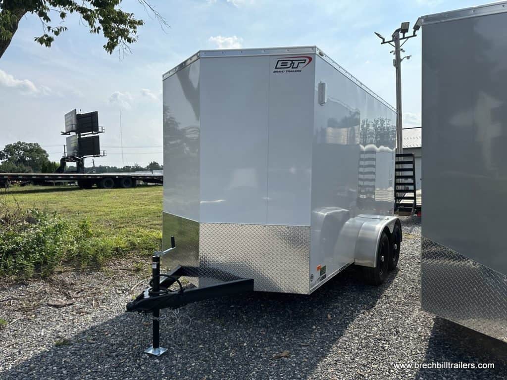 A new white Bravo Scout 7K Enclosed Cargo Trailer