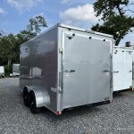 A silver Bravo Scout 7K Enclosed Cargo Trailer