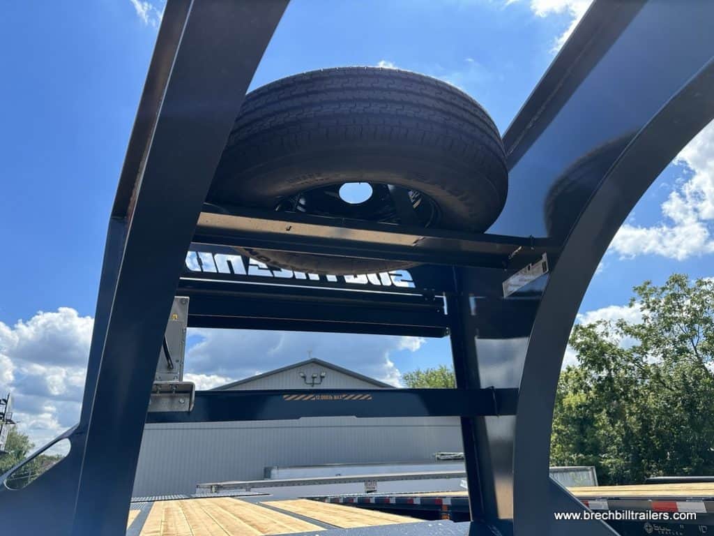 The spare tire viewed from the ground.