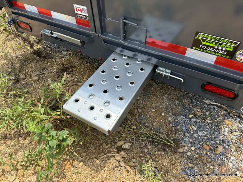 A ramp sliding out of the trailer.
