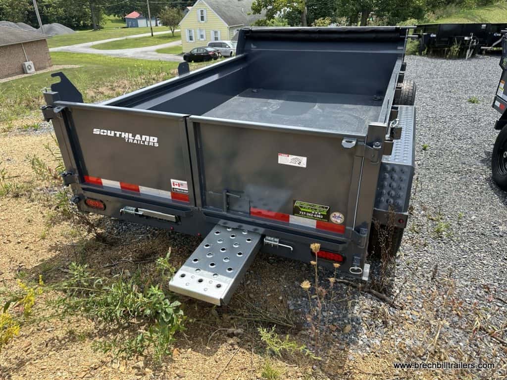 Back of trailer with ramp sliding out.