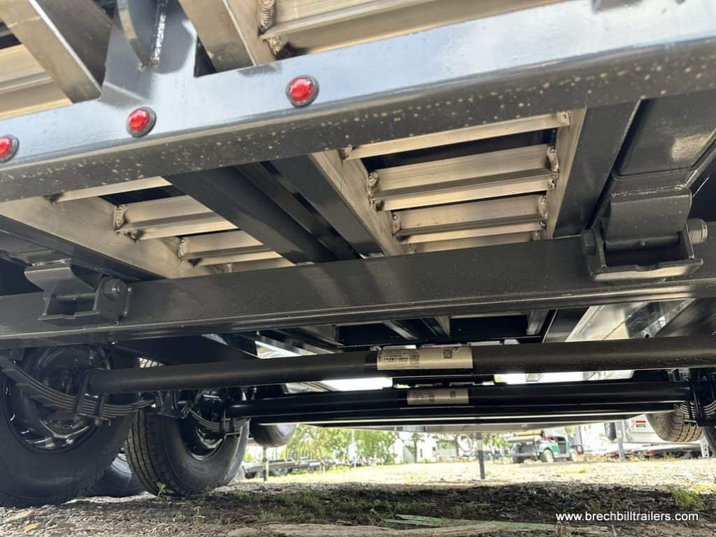 Viewing the suspension, ramps and axles under the Southland 15K Tandem Axle High Side Dump Trailer