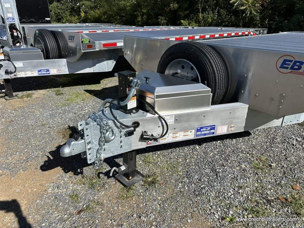 Coupler, stoage box and spare wheel on the EBY Deck-Over 16K Equipment Trailer