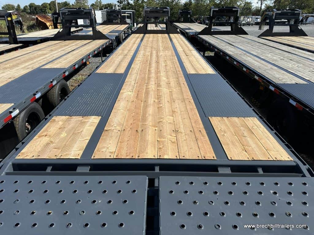 Looking down the deck of a Southland 29K Tandem Dual Gooseneck Trailer