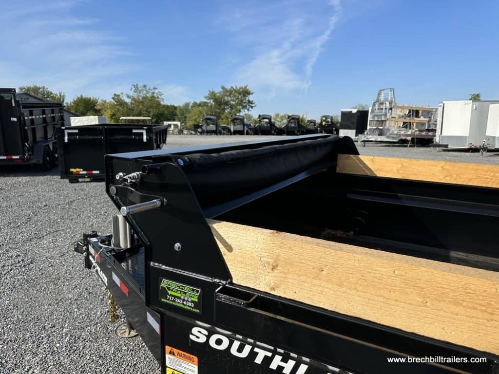 Southland 22K Tandem Axle Dump Trailer tarp system for securing loads.