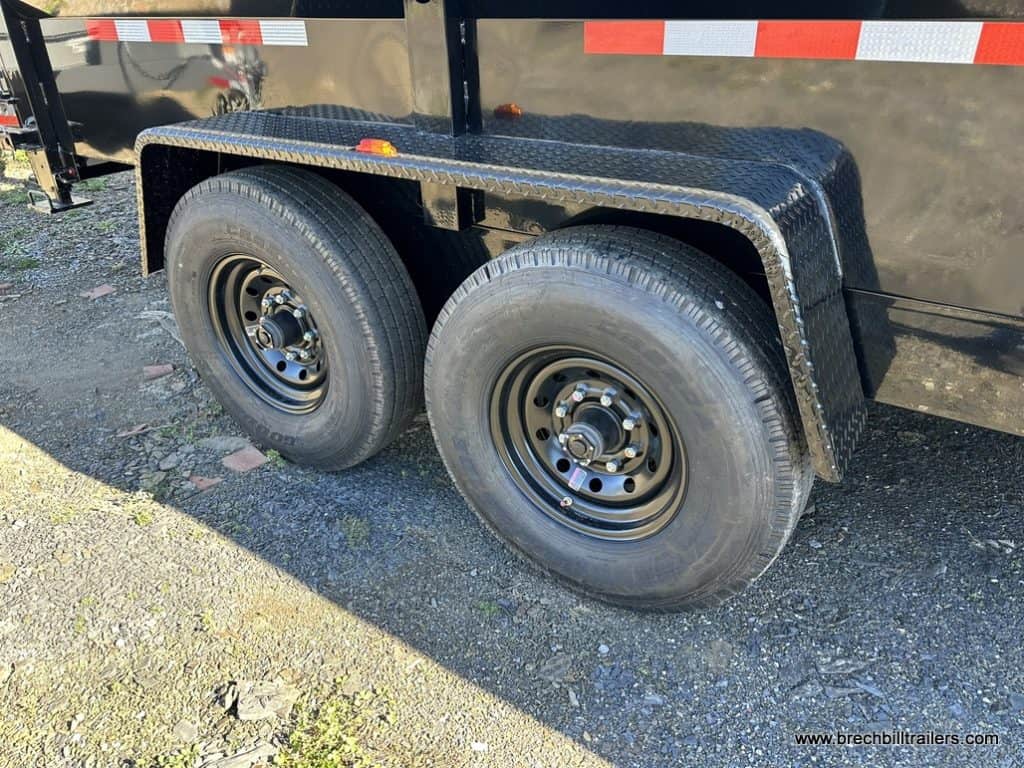 Black wheels on a new Bwise 16K Low Pro Dump Trailer 7x16