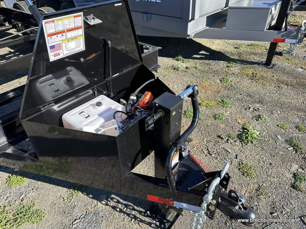 Trailer coupler, jack, and battery box.