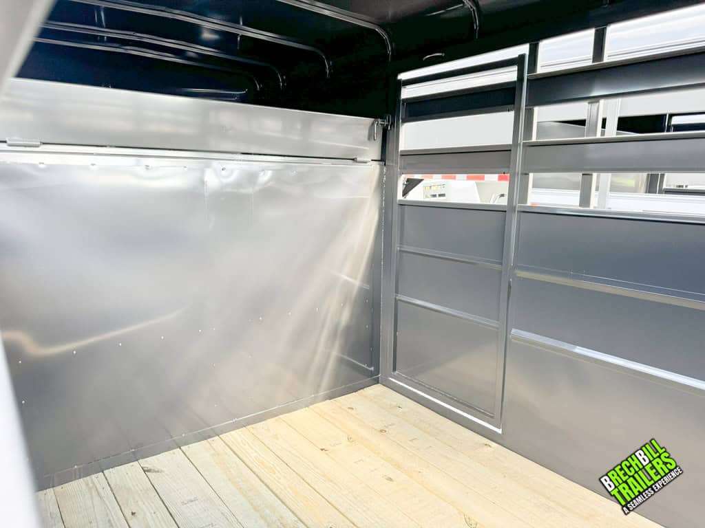 Inside a charcoal Valley 12k Gooseneck Stock Trailer