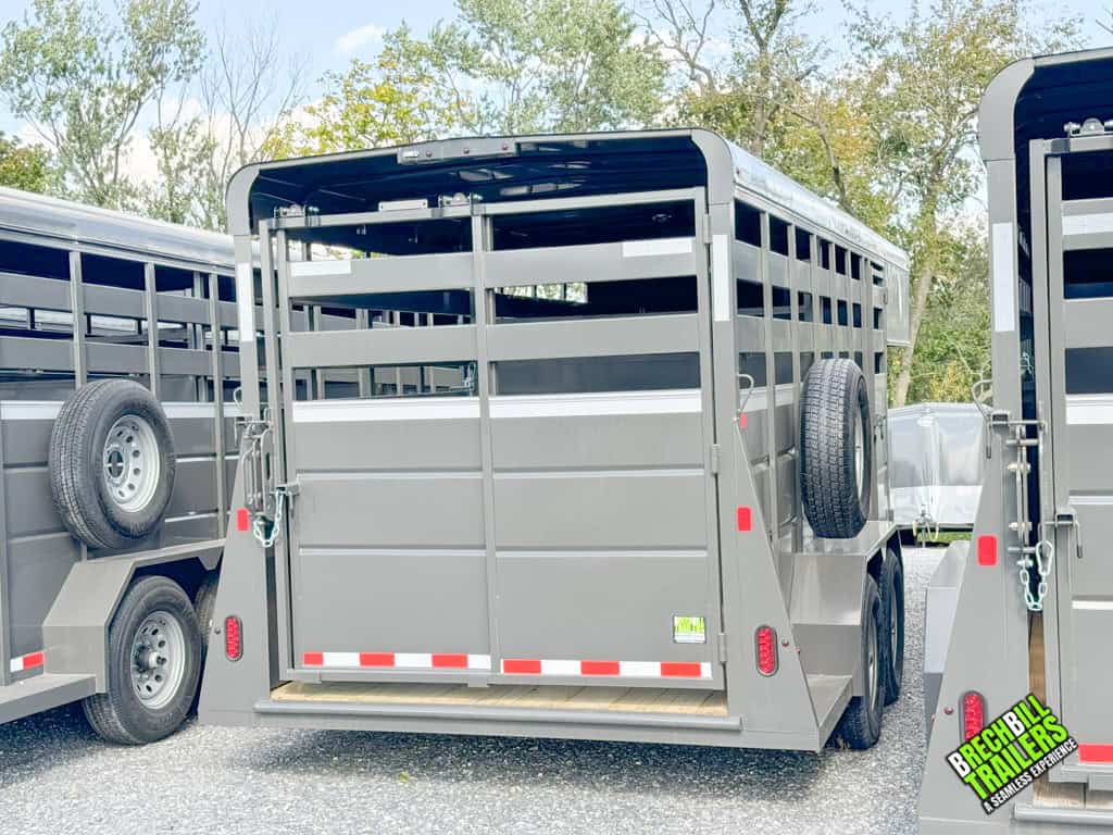 Back of a charcoal colored Valley 12k Gooseneck Stock Trailer
