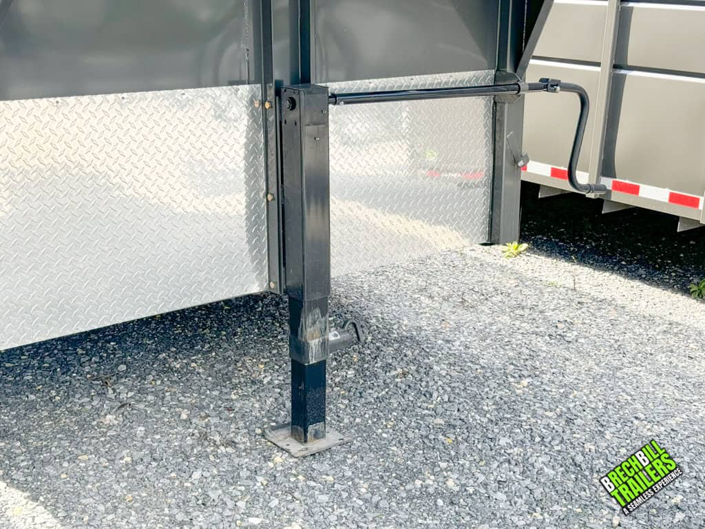 Jack holding up a parked Valley 12k Gooseneck Stock Trailer