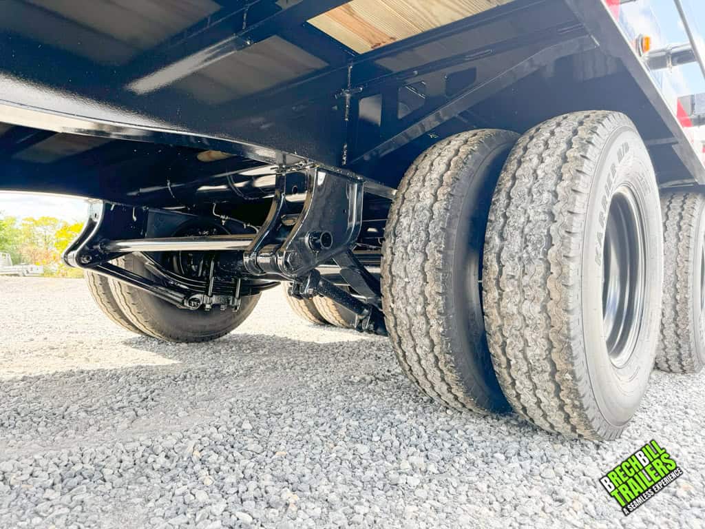 Underneath the Belmont 8.5x30 Heavy Duty Gooseneck Trailer where the axles are located.