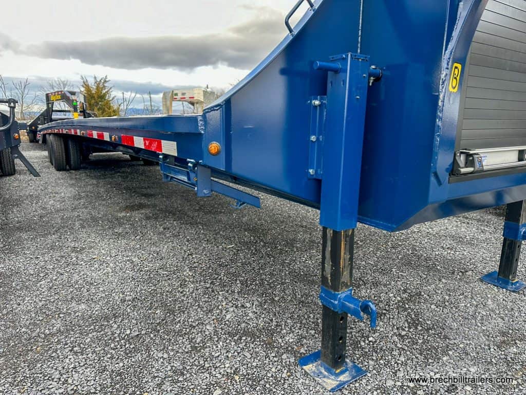 A blue Belmont HD 26K Deckover Gooseneck Trailer
