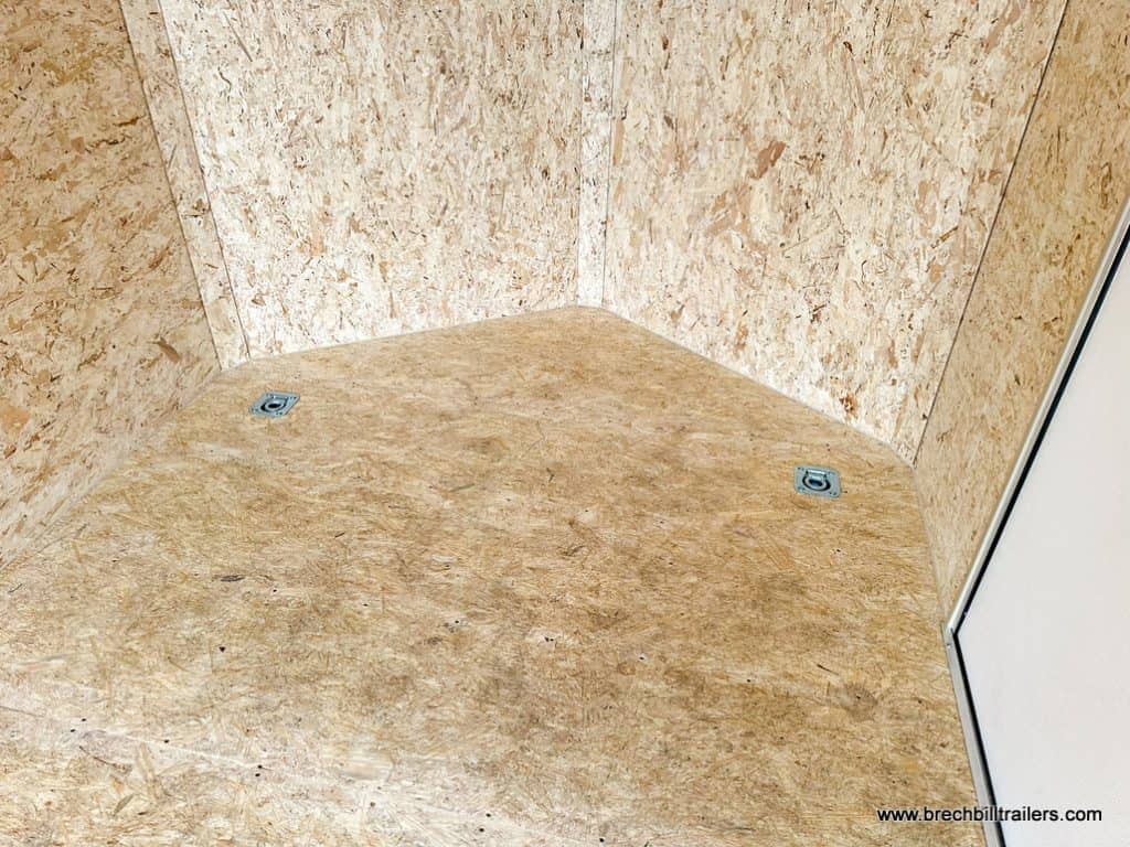 D rings on the floor of the Bravo 7x16 Enclosed Cargo Trailer