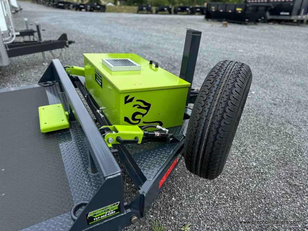 Spare tire mounted on the front of the trailer.