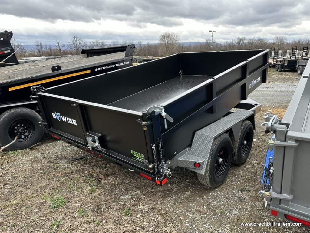 The Bwise dump trailer tilted in the parking lot for a full demonstration.