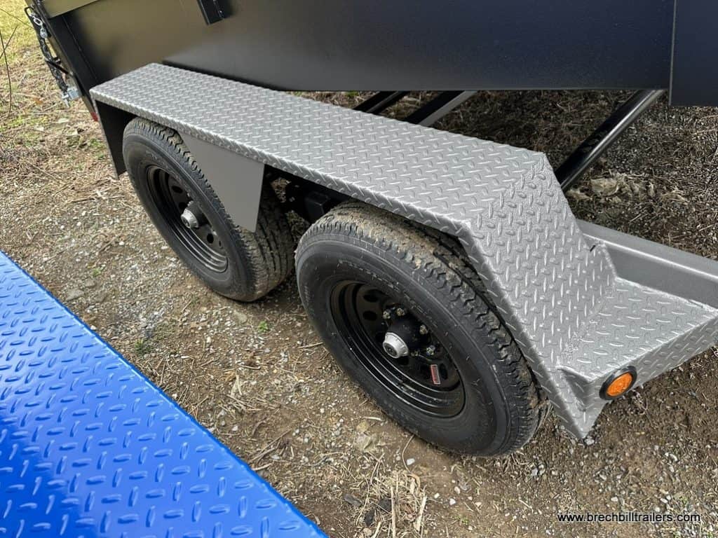 Gray fenders over the black wheels.