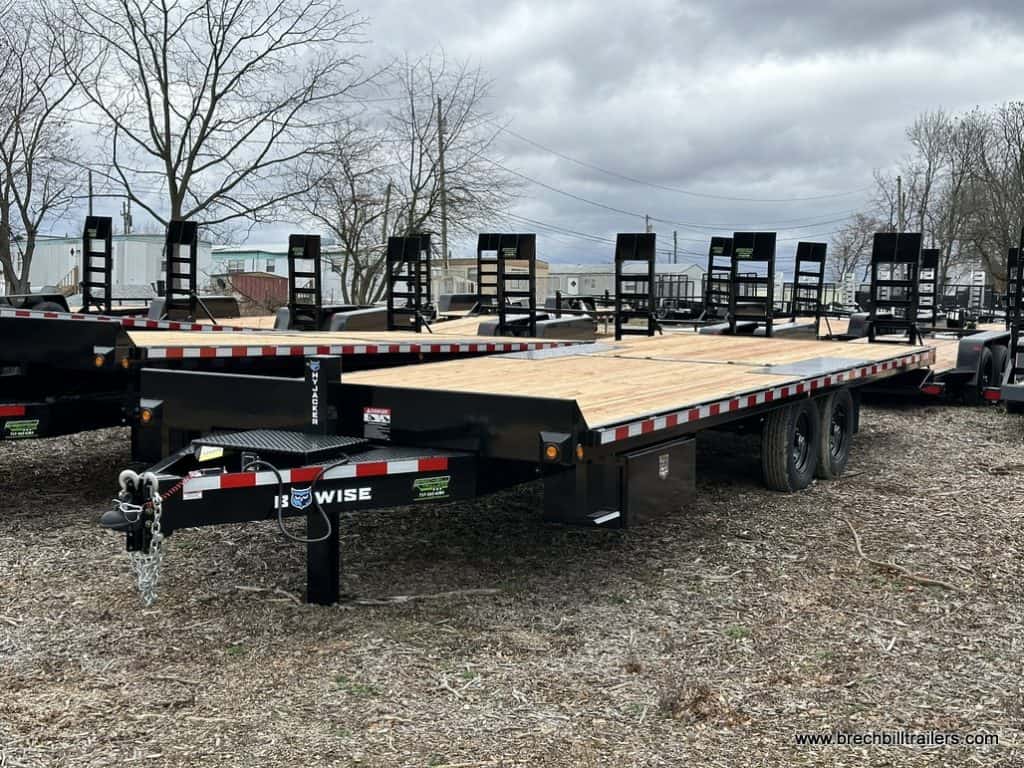 A Bwise 15.4K Hydraulic Tilt-Deck Trailer parked in the lot.