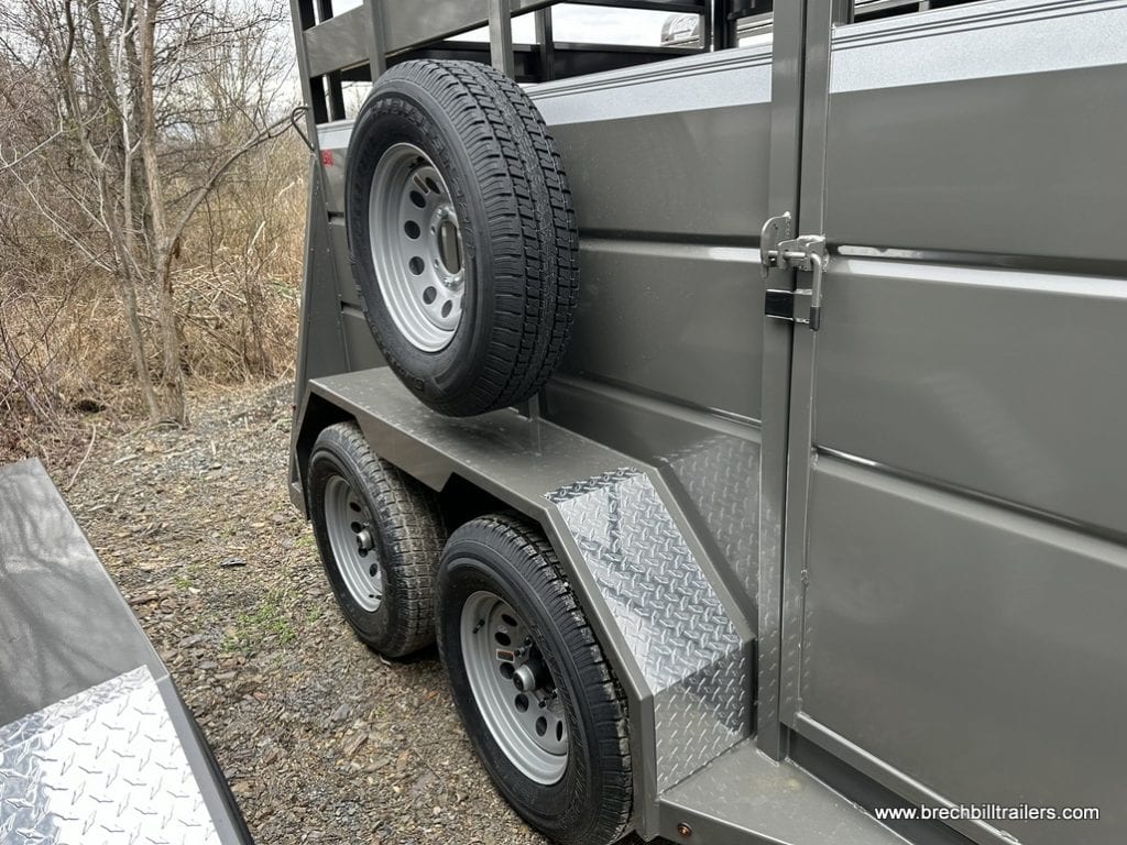 Spare tire mounted on the side of the trailer.