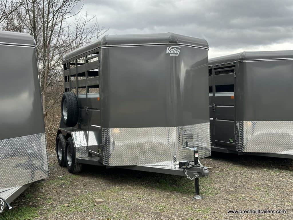 A new Valley 7x12 High Side Stock Trailer with swing door