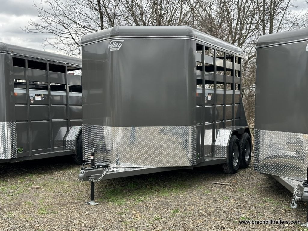 A new charcoal colored Valley 7x12 High Side Stock Trailer