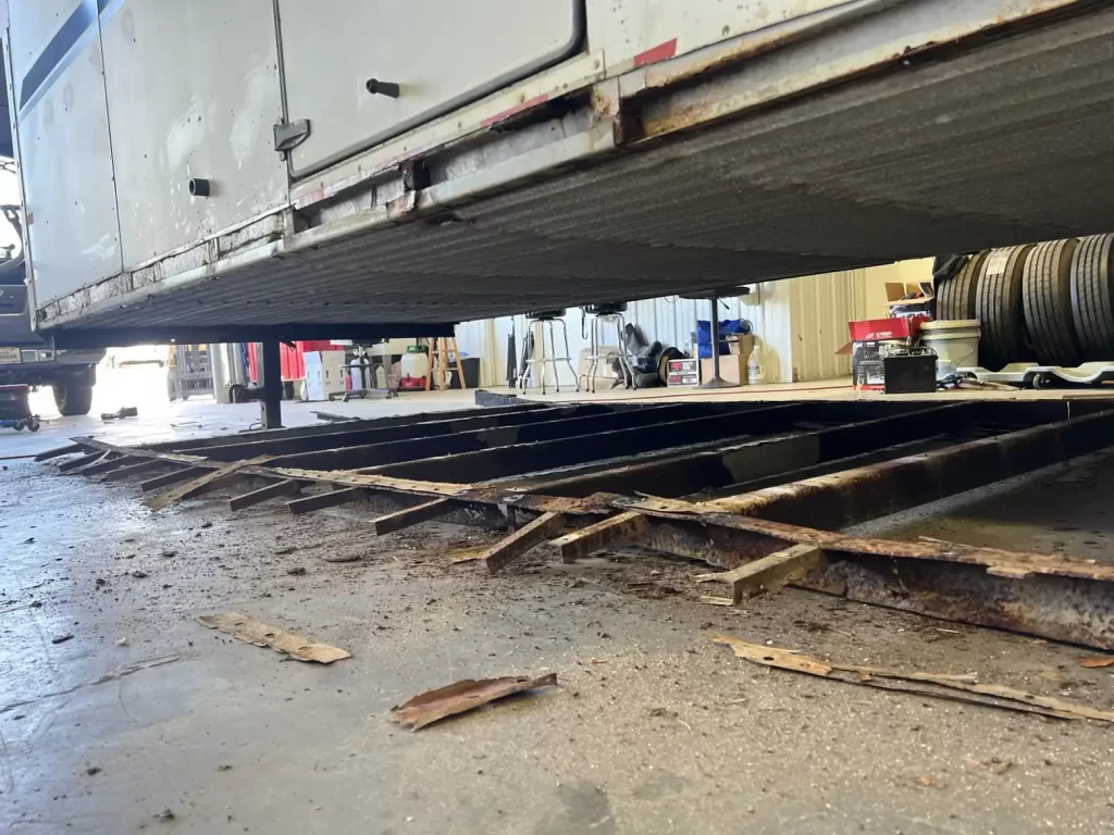 Rusted Out Trailer Frame Laying On Brechbill Trailer Shop Floor Being Restored