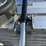 Cylinder closeup with spare tire in sight.