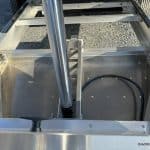 Cylinder raised to put trailer in dump position.