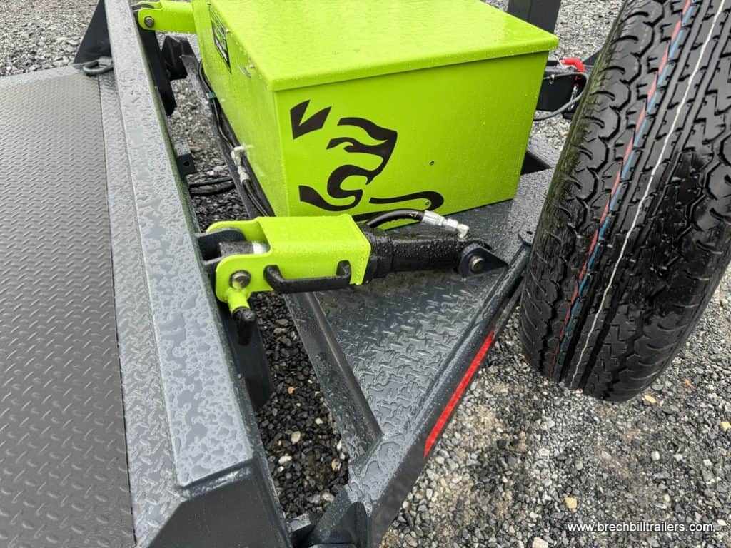Spare tire and green toolbox on the FlatTrak Flat Deck Scissor Lift