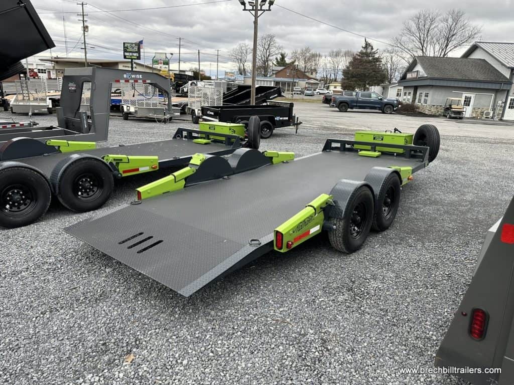 FlatTrak 7x18 Lay Flat 14K Equipment Hauler Trailer parked in the lot.