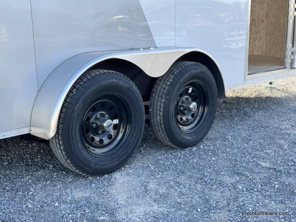 Wheels on a 7x16 Bravo Scout 7K Enclosed Cargo Box Trailer