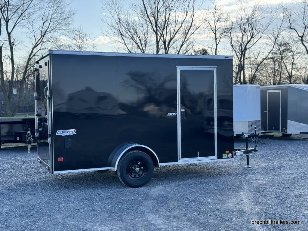 A black Bravo Scout 3K Enclosed Cargo Trailer