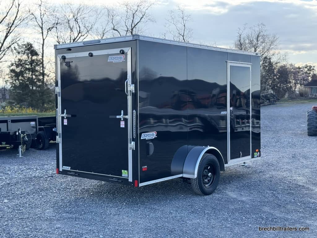 A new shiny black Bravo Scout 3K Enclosed Cargo Trailer