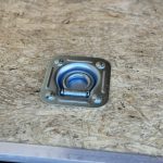 A d ring on the Bravo Scout 7K Enclosed Cargo Box Trailer floor