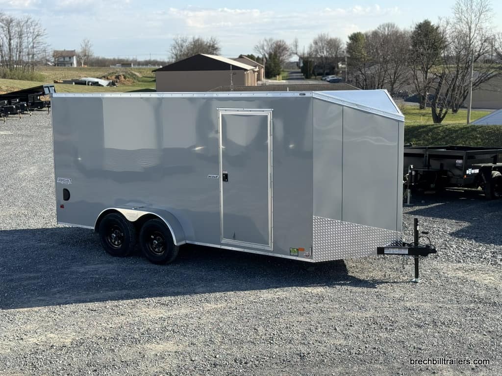 A detached Bravo Scout 7K Enclosed Cargo Box Trailer ready for pickup.