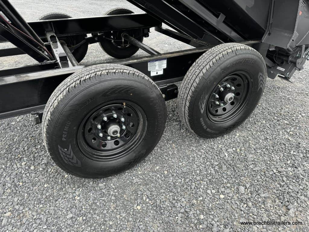 Black wheels on and axles on a Horizon 7x14 dump trailer
