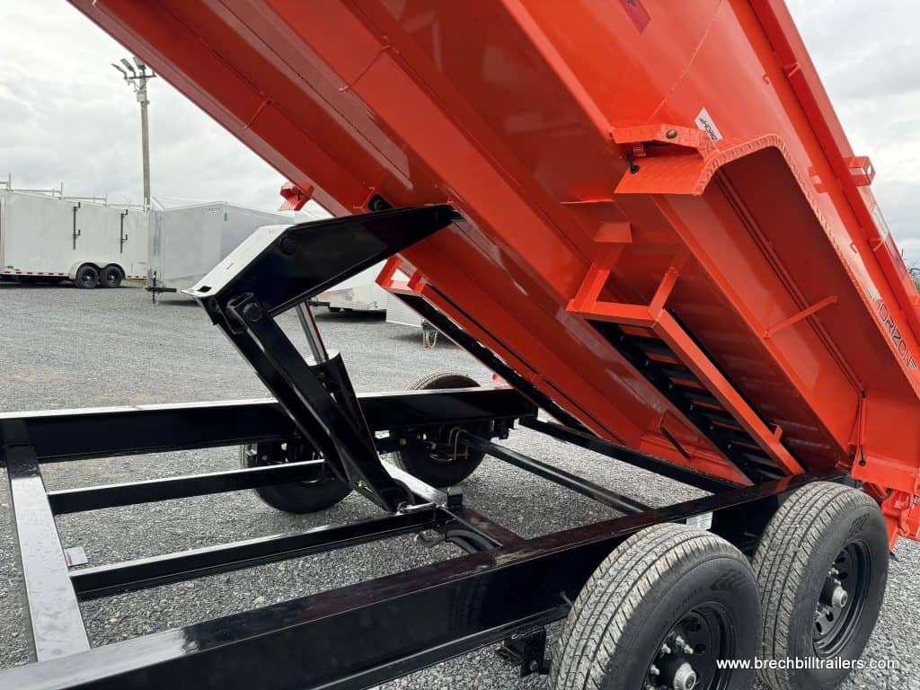 The cylinder raising the box on the dump trailer.