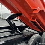 The cylinder raising the box on the dump trailer.