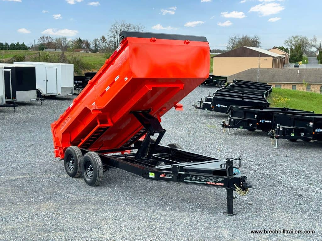 14ft long dump trailer in position to dump a load.