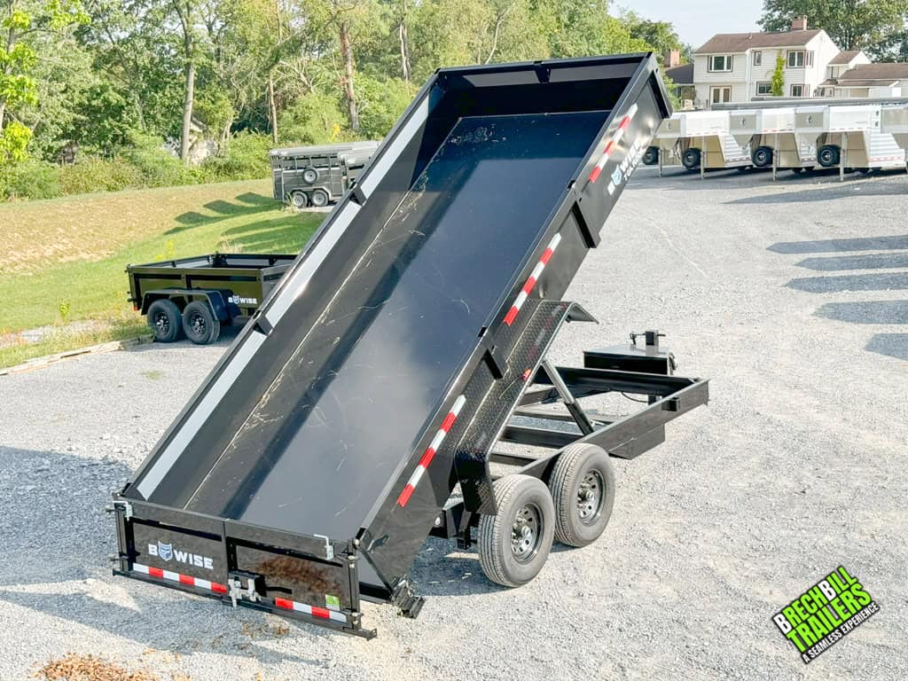 Black Bwise dump trailer in dumping position.