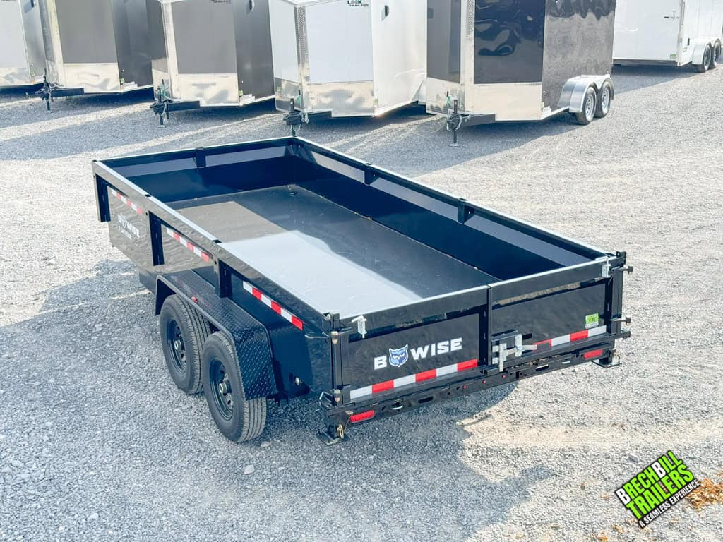 A black Bwise 14K LP LE Low Pro Dump Trailer parked at the dealership.