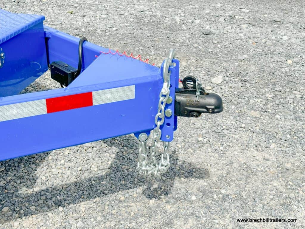 The trailer coupler and chains for hooking up to a truck.