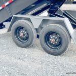 A new Bwise 7x16 DLP Heavy Duty Dump Trailer in the dump position.