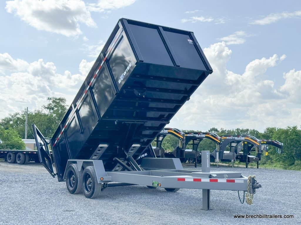 Black Bwise 7x16 DLP Heavy Duty Dump Trailer on display in the yard.