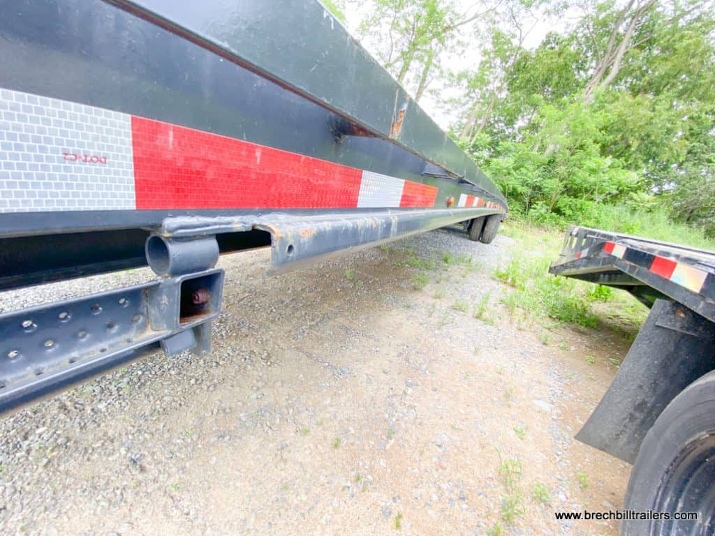Down the side of a Used Belmont 26K Heavy Duty Gooseneck Trailer