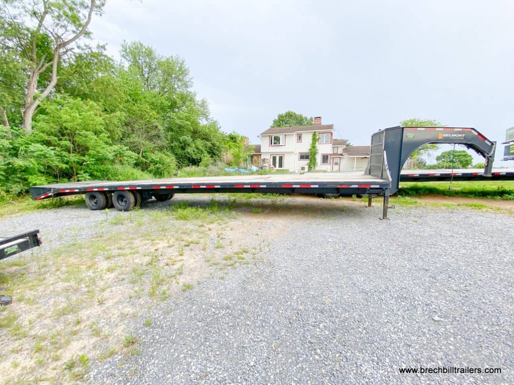 Side of a Used Belmont 26K Heavy Duty Gooseneck Trailer