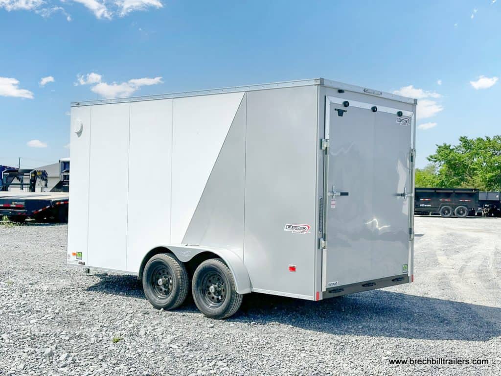 White and silver Bravo 7K Scout Enclosed Cargo Trailer from the side.