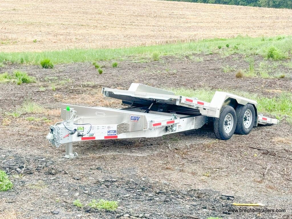 A EBY Aluminum Heavy Duty Gravity Tilt Trailer in the yard.