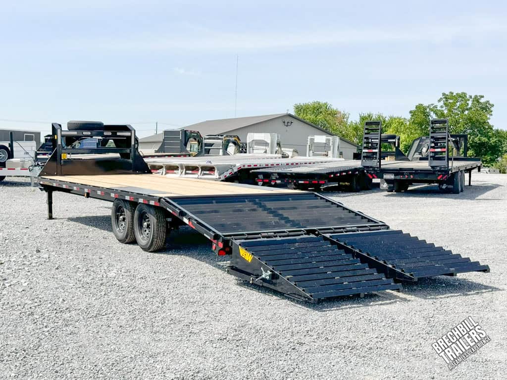 A 25ft Big Tex 16K Tandem Axle Gooseneck Trailer with ramps down.