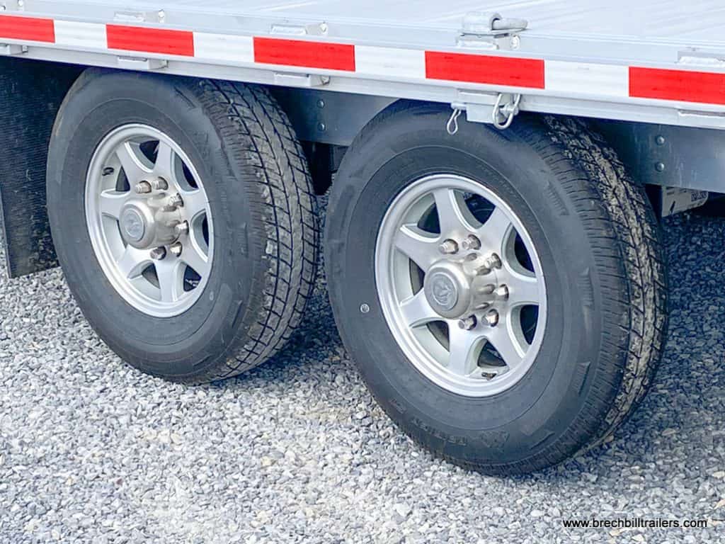 A Like New EBY 14K Deck-Over Equipment Trailer with dual axles