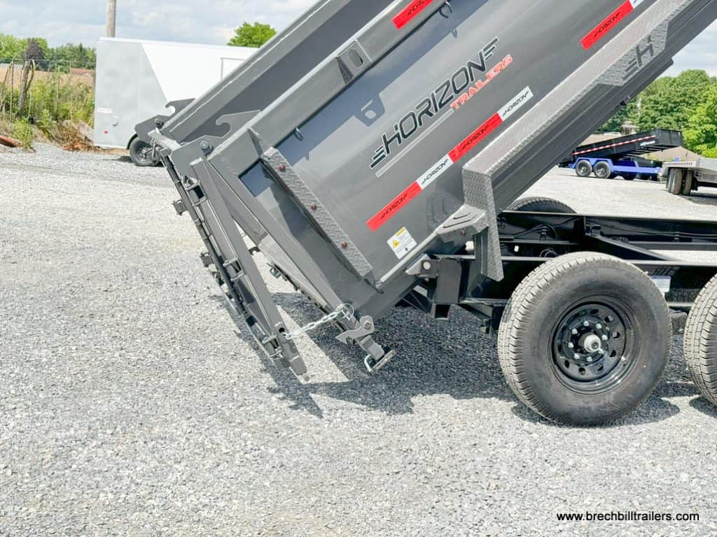 Horizon HD 14k Dump Trailer in dump position with spread gate open.